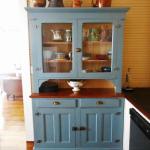 Antique installed blue cabinet in kitchen.